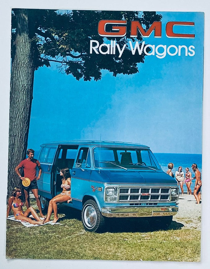 1978 GMC Rally Wagons Dealer Showroom Sales Brochure Guide Catalog featuring a vintage blue GMC Rally Wagon parked on a beach surrounded by people in summer attire and a scenic backdrop of trees and water.