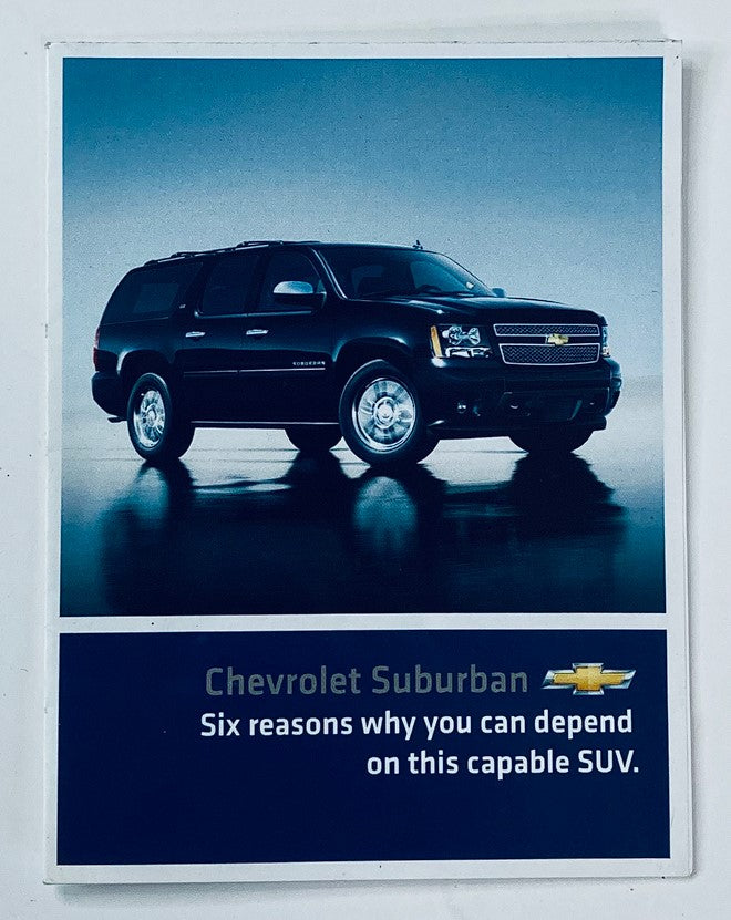 2010s Chevrolet Suburban Dealer Showroom Sales Brochure showcasing a black Chevrolet Suburban SUV with text highlighting its six dependability reasons.