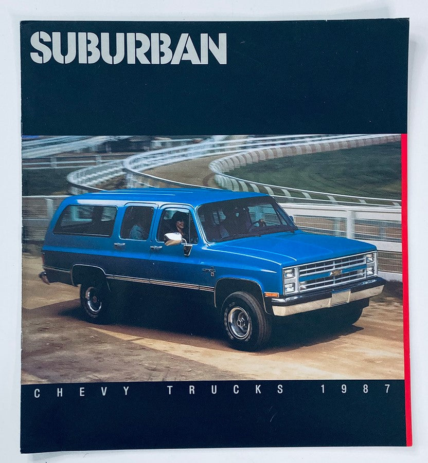 Cover of the 1987 Chevrolet Suburban Trucks Dealer Showroom Sales Brochure Guide Catalog featuring a blue Chevrolet Suburban truck on a racetrack.
