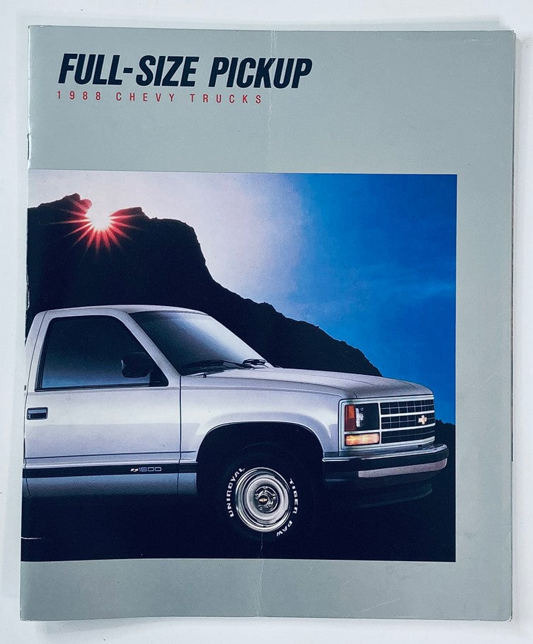 1988 Chevrolet Full-Size Pickup Dealer Showroom Sales Brochure featuring a silver Chevy truck parked in front of a rocky mountain backdrop with a sunburst highlight.