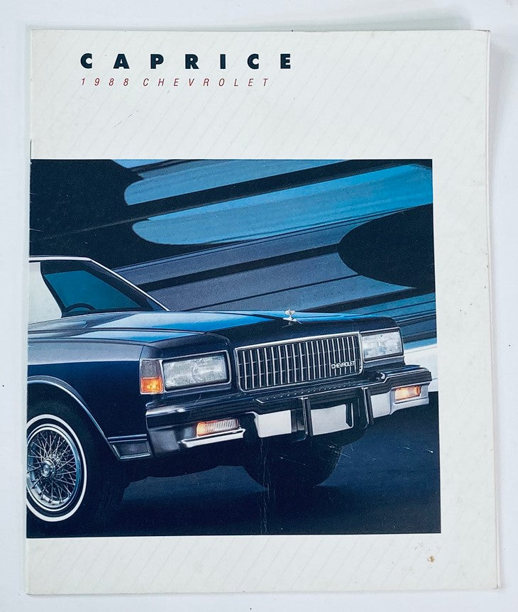 Cover image of the 1988 Chevrolet Caprice Dealer Showroom Sales Brochure Guide Catalog, featuring a black Chevrolet Caprice with stylish design elements against a dynamic background.