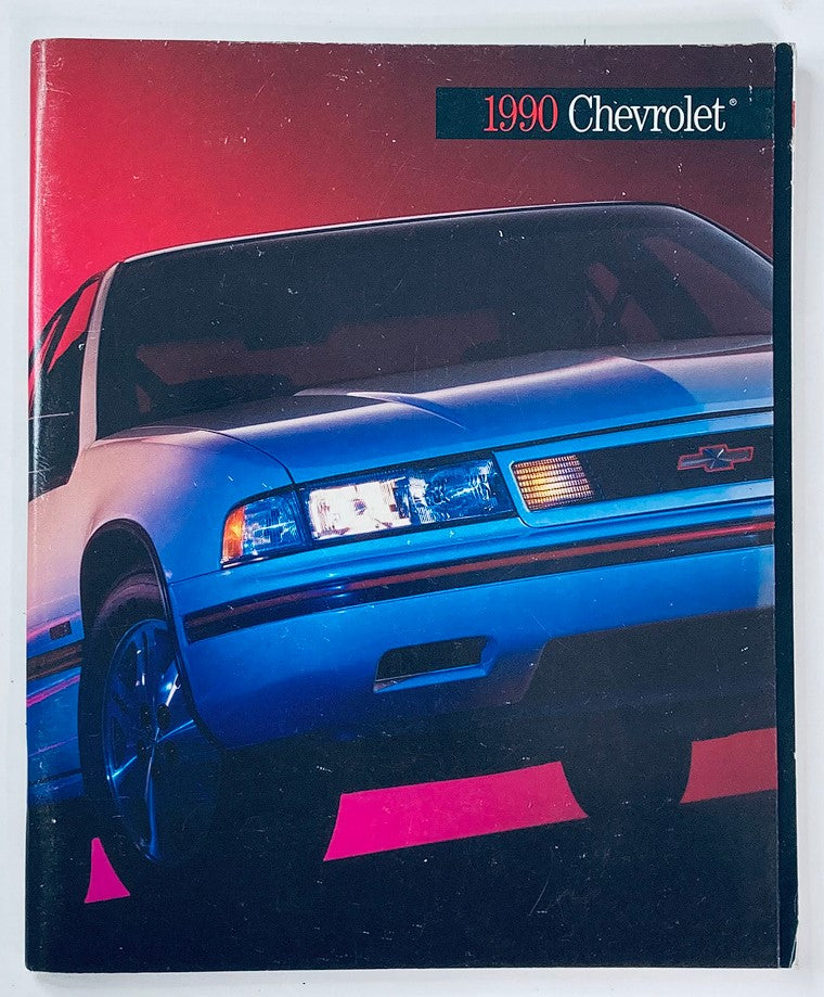 1990 Chevrolet Lumina Dealer Showroom Sales Brochure featuring the iconic car model on a striking background, showcasing the vehicle's design and features.