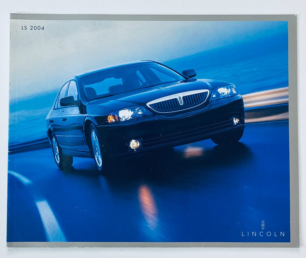 2004 Lincoln LS Dealer Showroom Sales Brochure Guide Catalog featuring a sleek black Lincoln LS on a scenic road.