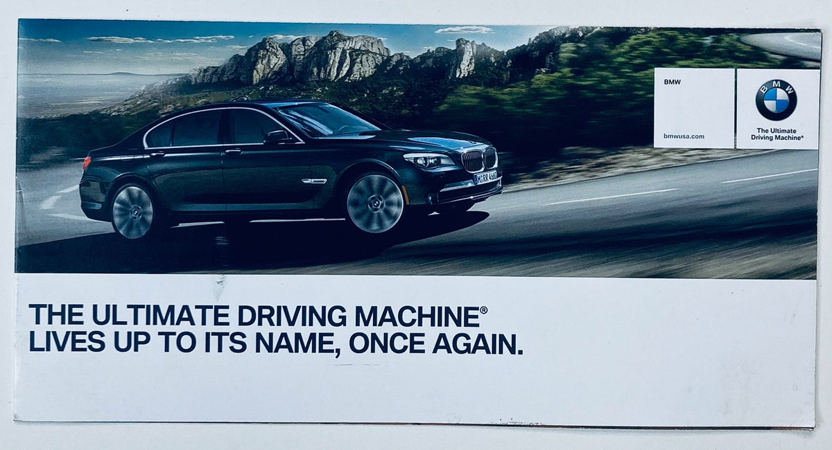 2000s BMW 7 Series Dealer Showroom Sales Brochure Guide Catalog featuring a sleek black BMW sedan driving on a scenic road, highlighting the tagline 'The Ultimate Driving Machine® Lives Up to Its Name, Once Again.'