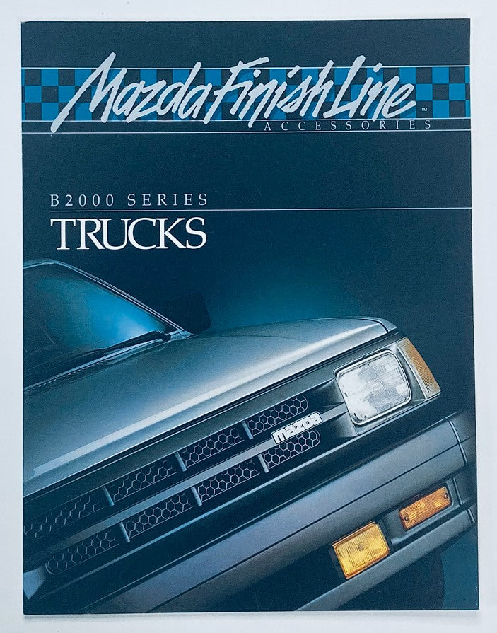 1986 Mazda B2000 Series Dealer Showroom Sales Brochure Guide Catalog featuring a sleek black truck, showcasing the Mazda Finish Line Accessories and focusing on B2000 Series trucks.