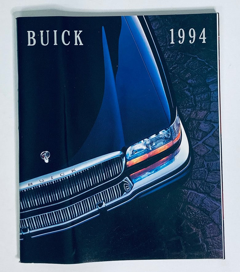 1994 Buick Dealer Showroom Sales Brochure Guide Catalog featuring a sleek front view of a Buick car against a dark backdrop.