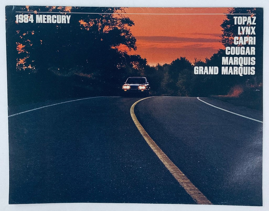 1984 Mercury Topaz, Lynx, Capri Dealer Showroom Sales Brochure featuring a scenic sunset road view with a car, showcasing vehicle models and promotional details.