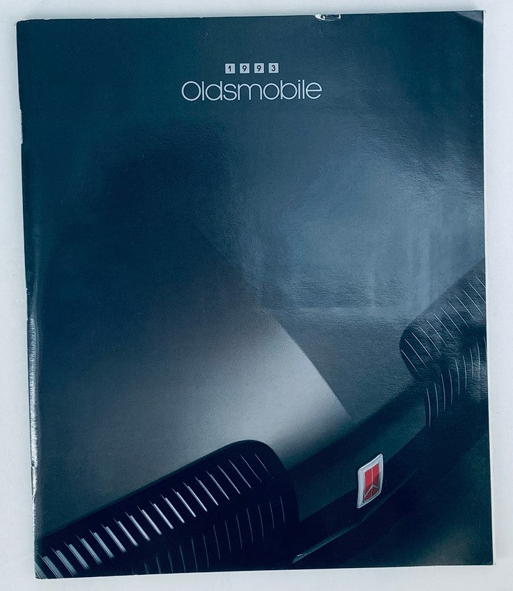 Cover of the 1993 Oldsmobile Full Lineup Dealer Showroom Sales Brochure Guide Catalog featuring a sleek black design and the Oldsmobile logo.