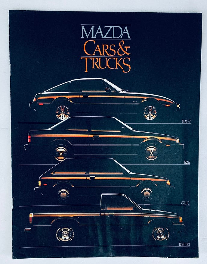Cover of the 1985 Mazda Cars & Trucks Dealer Showroom Sales Brochure Guide Catalog showcasing illustrations of the RX-7, 626, GLC, and B2000 models against a dark background.