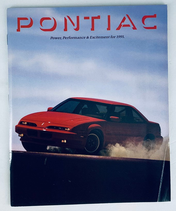 1991 Pontiac Lineup Dealer Showroom Sales Brochure featuring a red Pontiac car in action, showcasing power, performance, and excitement for the year 1991.
