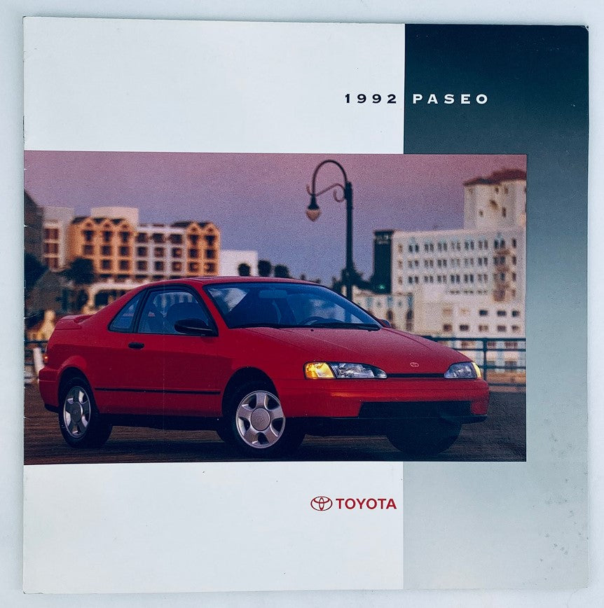 1992 Toyota Paseo Lineup Dealer Showroom Sales Brochure featuring a red Toyota Paseo parked near a waterfront backdrop.