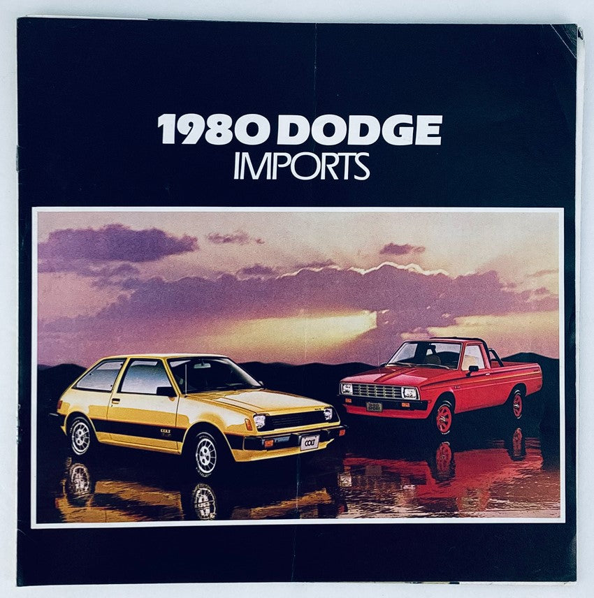 1980 Dodge Imports showroom brochure featuring a yellow hatchback and red pickup truck against a scenic background, showcasing the vehicle lineup in an eye-catching design.