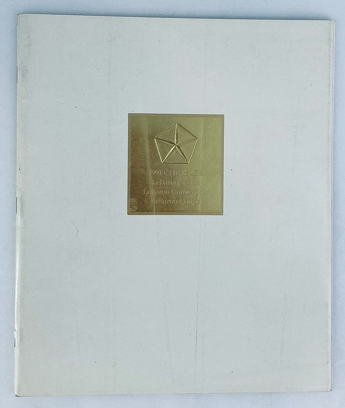 Cover of the 1991 Chrysler LeBaron Sedan Dealer Showroom Sales Brochure Guide Catalog featuring a gold emblem on a white background.