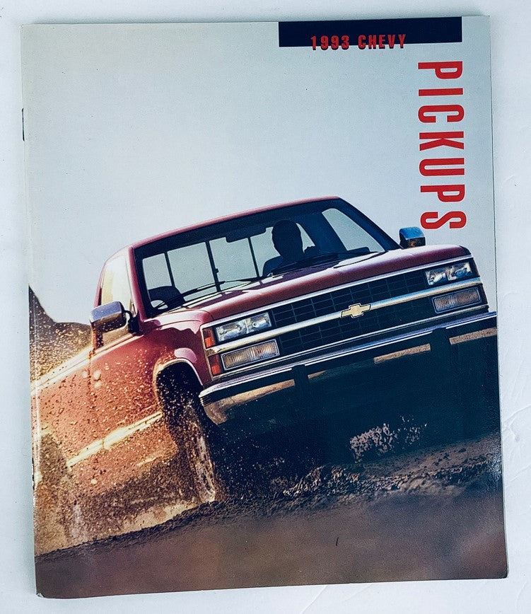 Cover of the 1993 Chevrolet Pickups Dealer Showroom Sales Brochure Guide Catalog featuring a red Chevrolet truck splashing through mud, showcasing its rugged design and off-road capabilities.