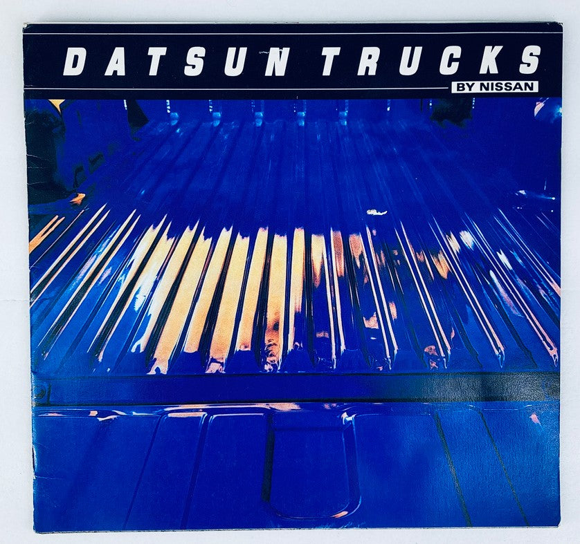 1981 Nissan Datsun Truck Dealer Showroom Sales Brochure Guide Catalog cover featuring a vibrant blue truck bed.