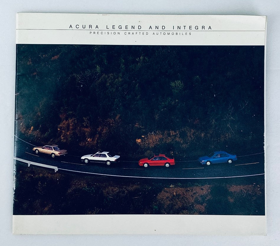 1987 Acura Legend & Integra Dealer Showroom Sales Brochure showcasing an overhead view of multiple Acura vehicles on a scenic road, highlighting the precision crafted automobiles.