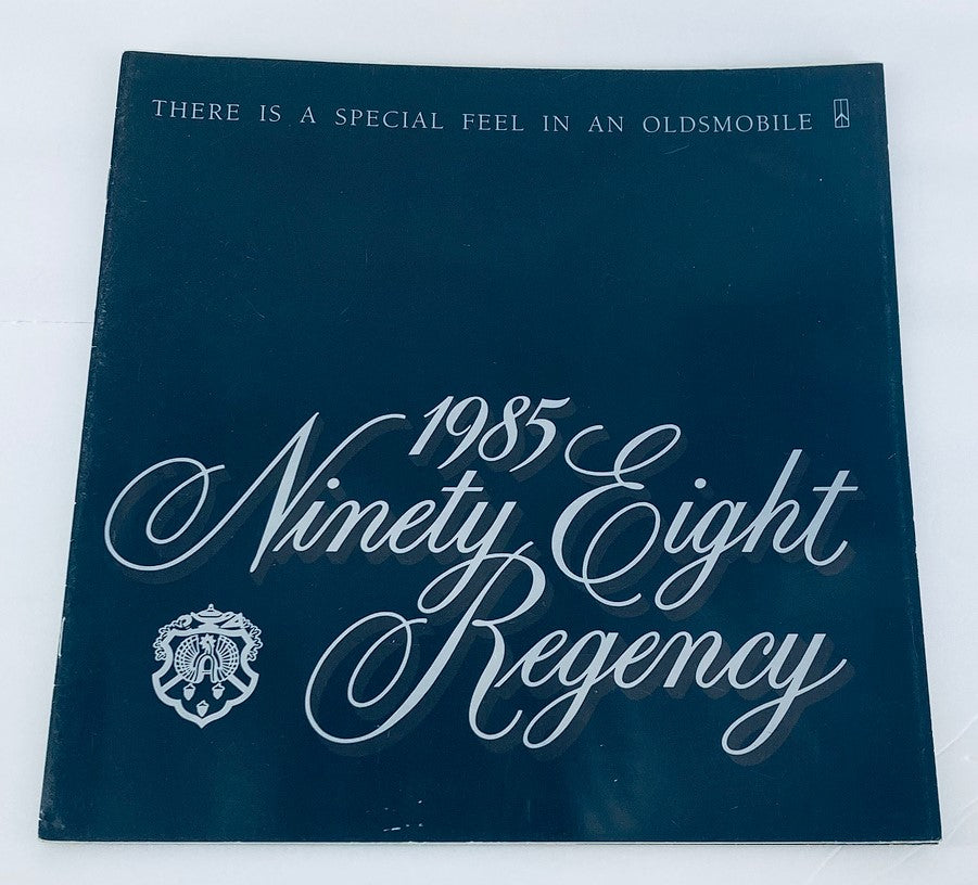 1985 Oldsmobile Ninety Eight Regency Dealer Showroom Sale Brochure, showcasing the elegant design and branding of the vehicle, emphasizing 'There is a special feel in an Oldsmobile'.