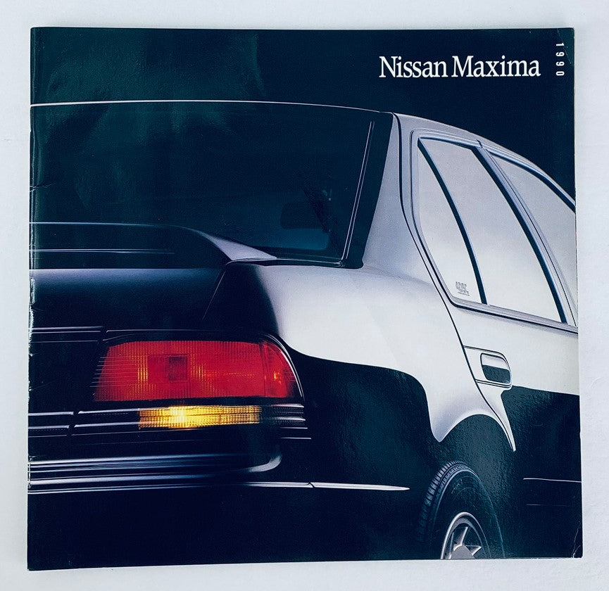 Cover image of the 1990 Nissan Maxima Dealer Showroom Sales Brochure Guide Catalog, featuring a sleek black Nissan Maxima with a focus on its rear design.