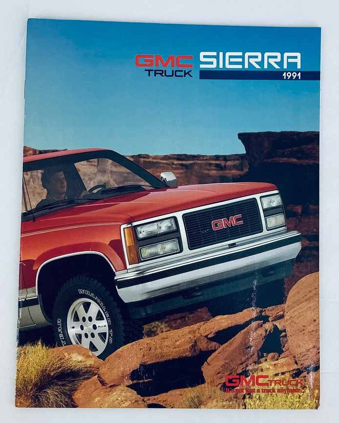 Cover of the 1991 GMC Truck Sierra Dealer Showroom Sales Brochure Guide Catalog featuring a GMC Sierra truck in a rugged outdoor setting, showcasing its design and appeal for enthusiasts and collectors.