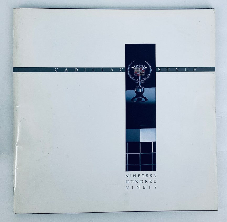 1990 Cadillac Style Dealer Showroom Sales Brochure cover featuring the Cadillac emblem and a sleek design, representing automotive luxury and elegance.