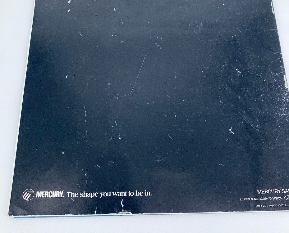 Back cover of the 1986 Mercury Sable Dealer Showroom Sales Brochure Guide Catalog displaying the Mercury logo and a tagline, 'The shape you want to be in.'
