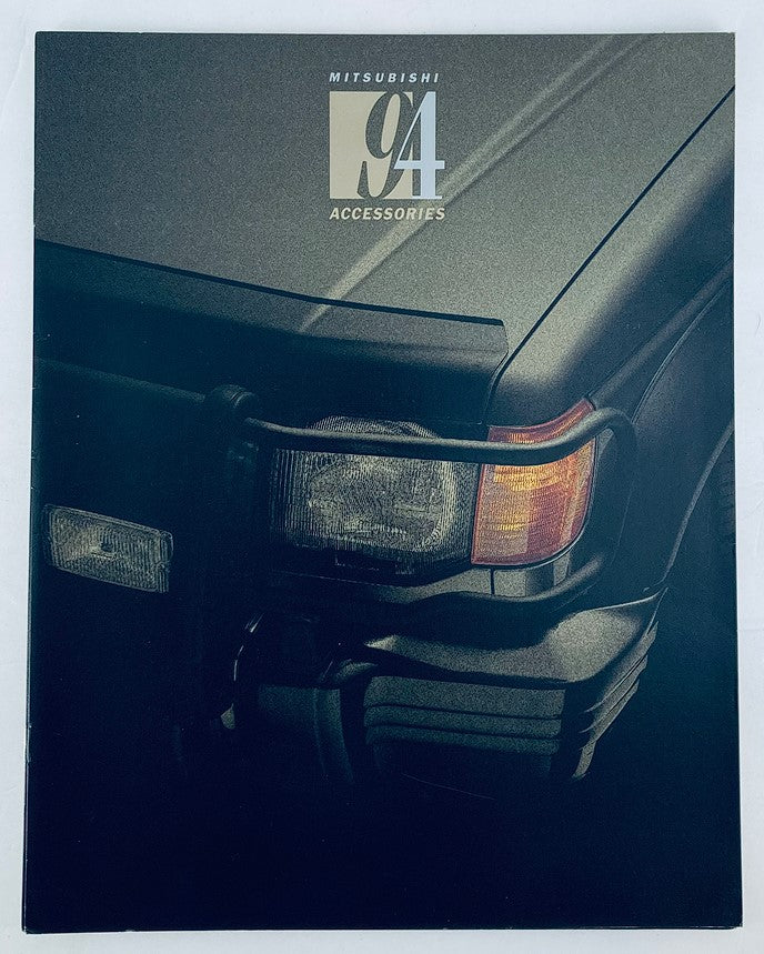 Cover image of the 1994 Mitsubishi Accessories Dealer Showroom Sales Brochure Guide Catalog, featuring a close-up of a Mitsubishi vehicle's front light and bumper.