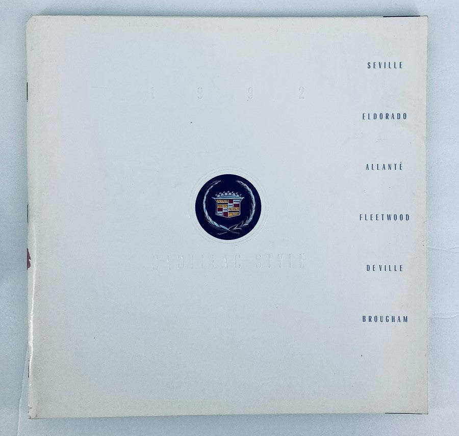 Cover of the 1992 Cadillac Style Seville Dealer Showroom Sales Brochure Guide Catalog featuring Cadillac emblem and model names.