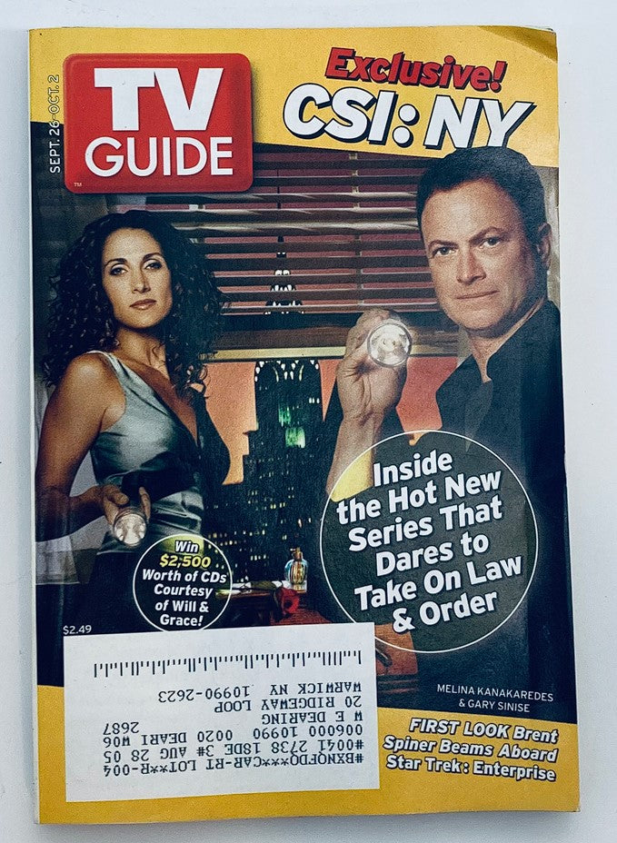 Cover image of TV Guide Magazine September 26, 2004 featuring Melina Kanakaredes and Gary Sinise, promoting the new series CSI: NY, set against a backdrop of the New York City skyline.