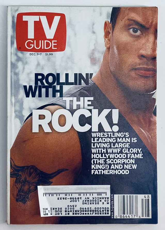 Cover of TV Guide Magazine from December 1, 2001, featuring Dwayne Johnson, known as The Rock, with the headline 'Rollin' with The Rock!' Provides a glimpse into early 2000s entertainment and culture.
