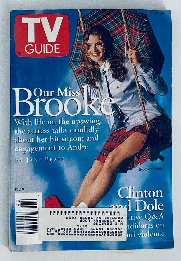 TV Guide Magazine cover from October 19, 1996 featuring Brooke Shields, with the title 'Our Miss Brooke', showcasing her in a stylish outfit, including plaid skirt and holding an umbrella, along with mentions of Clinton and Dole's political Q&A.