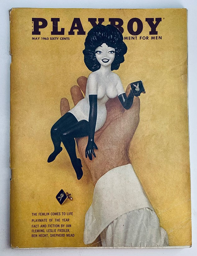 VTG Playboy Magazine May 1963 cover featuring a hand holding a playful illustration of a female figure. This iconic issue includes Sharon Cintron as centerfold.