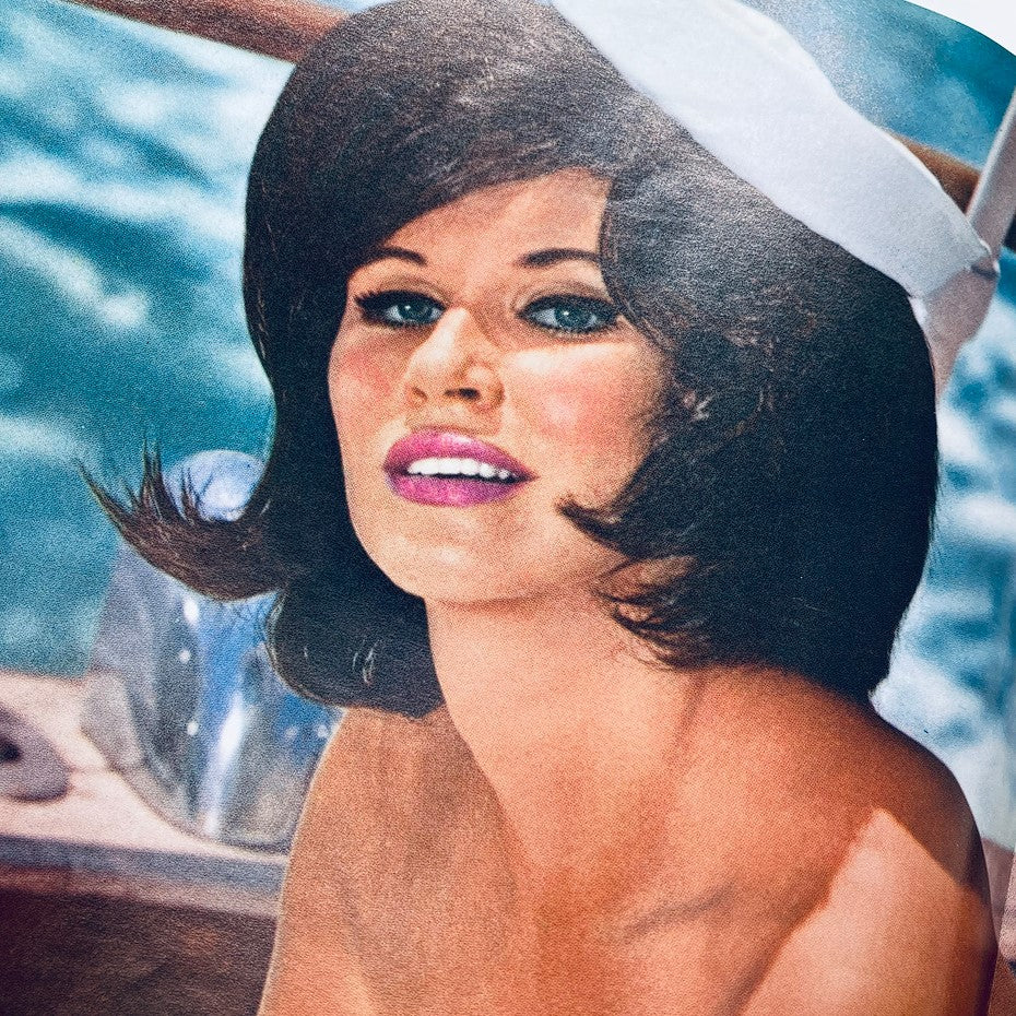 Centerfold image of Sandra Settani from VTG Playboy Magazine April 1963, showcasing her in a nautical theme, exemplifying beauty and fashion trends of the early 1960s.