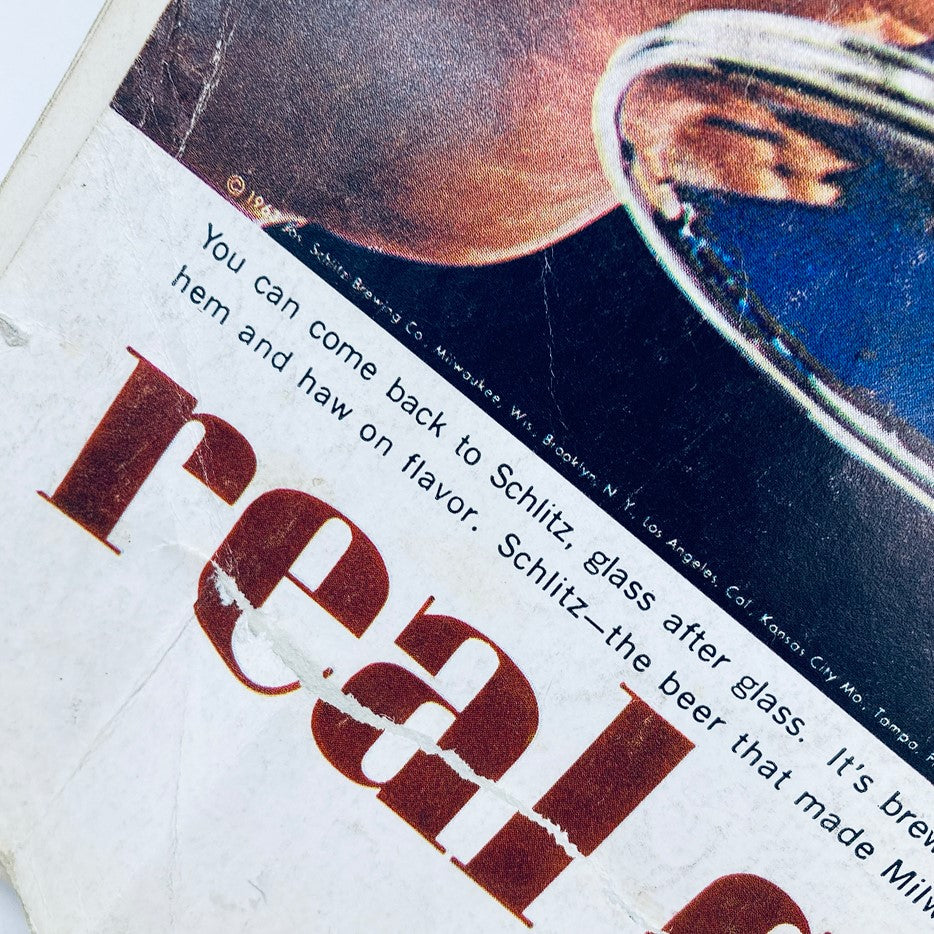 Detail shot of Schlitz beer advertisement in April 1963 Playboy Magazine featuring text about the beer's light flavor and appeal.
