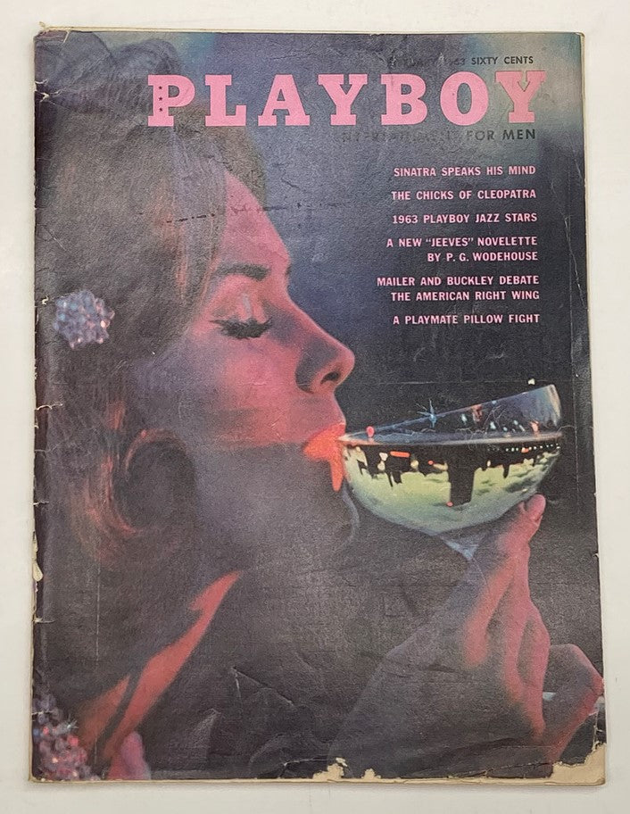 Vintage Playboy Magazine February 1963 featuring Toni Ann Thomas on the cover, showcasing a classic image of a woman sipping from a cocktail glass.