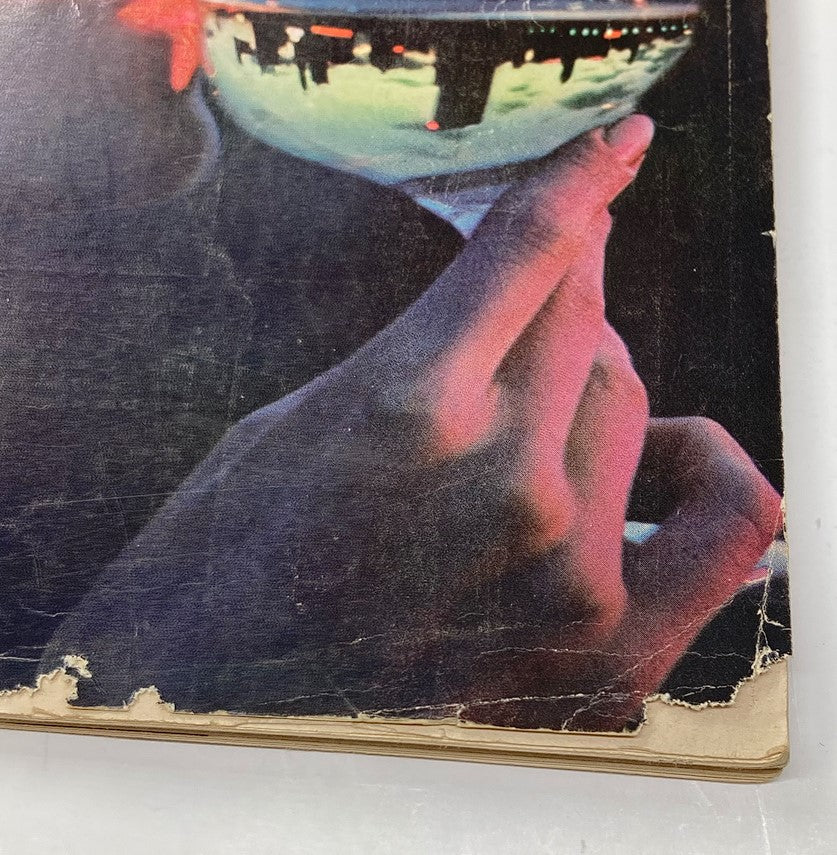 Vintage Playboy Magazine February 1963 cover detail featuring a dramatic photo of a hand holding a cocktail glass.