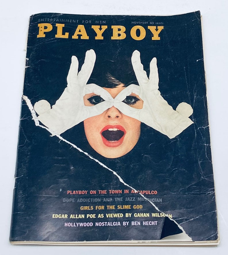 VTG Playboy Magazine November 1960 cover featuring a striking image of a woman making hand gestures, iconic design reflecting vintage style.