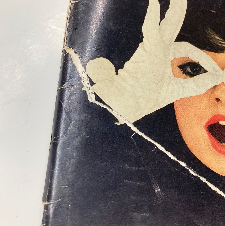 Detailed view of the dramatic cover of VTG Playboy Magazine November 1960, emphasizing the vintage charm and graphic elements.