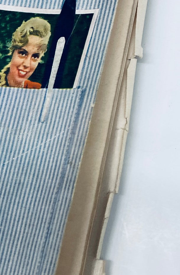 Close-up view of a vintage Playboy Magazine from September 1958, titled 'The Subliminal Pitch', featuring a photograph of a woman on the magazine cover.