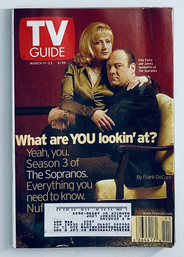 TV Guide Magazine March 17, 2001 featuring Edie Falco and James Gandolfini from The Sopranos, depicting them on the cover with the tagline 'What are YOU lookin' at?'. This collectible magazine highlights iconic early 2000s television.