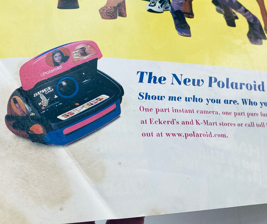 Advertisement for the New Polaroid camera inside Teen Machine Magazine Presents October 1998 featuring a colorful design.