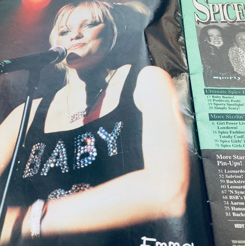 Teen Machine Magazine Presents October 1998 Spice Girls & Company cover image featuring a performer with a microphone wearing a black tank top adorned with rhinestones spelling 'BABY', capturing the essence of the '90s pop culture.