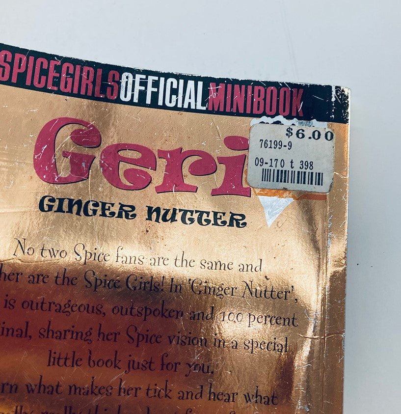 Close-up of the back cover of the 1997 Official Spice Girls Minibook 'Geri Ginger Nutter', highlighting pricing information and a snippet about Geri's unique qualities.