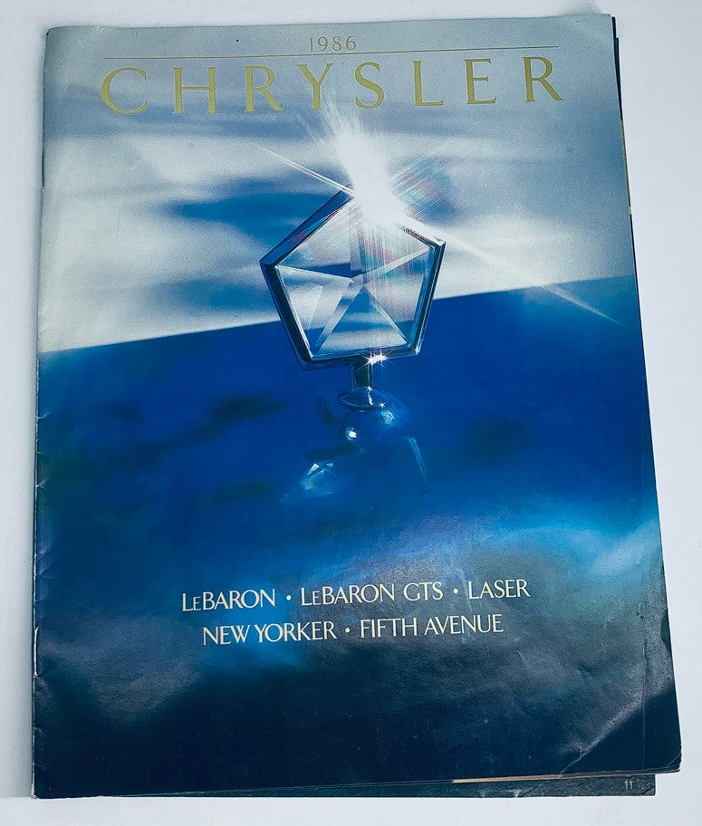 Cover of the 1986 Chrysler LeBaron GTS Dealer Showroom Sales Brochure featuring a Chrysler logo against a blue backdrop, highlighting the LeBaron, LeBaron GTS, Laser, New Yorker, and Fifth Avenue models.