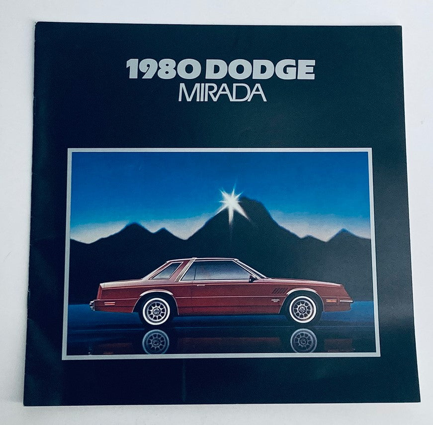 1980 Dodge Mirada Dealer Showroom Sales Brochure Cover featuring the stylish design of the Dodge Mirada against a scenic backdrop.