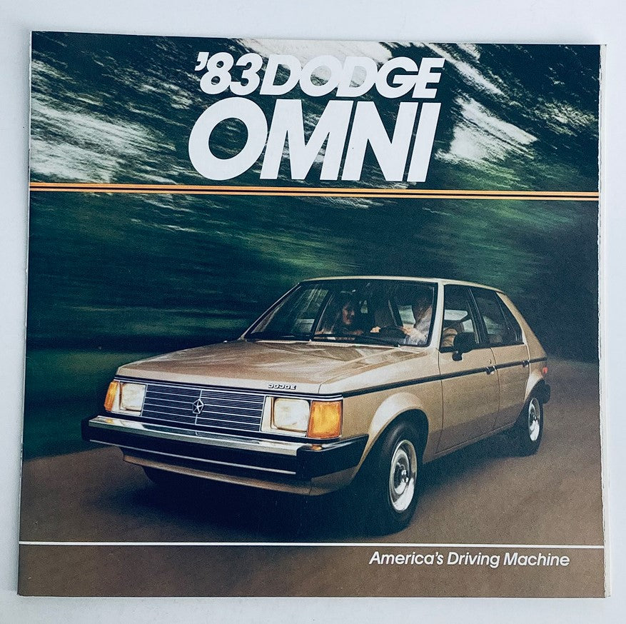 Cover of the 1983 Dodge Omni Dealer Showroom Sales Brochure showcasing the classic compact car, featuring a beige Dodge Omni on a picturesque road background with the tagline 'America's Driving Machine'.