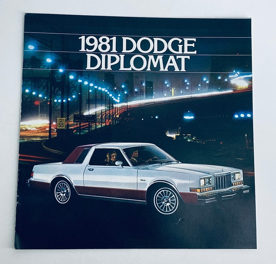 1981 Dodge Diplomat Dealer Showroom Sales Brochure featuring a silver Dodge Diplomat car with a red top, illuminated city backdrop, showcasing the stylish design and features of the vehicle.