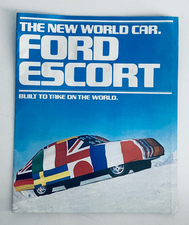 1981 Ford Escort Dealer Showroom Sales Brochure Cover featuring the tagline 'THE NEW WORLD CAR. FORD ESCORT' with the car wrapped in flags representing various countries, emphasizing its global appeal.