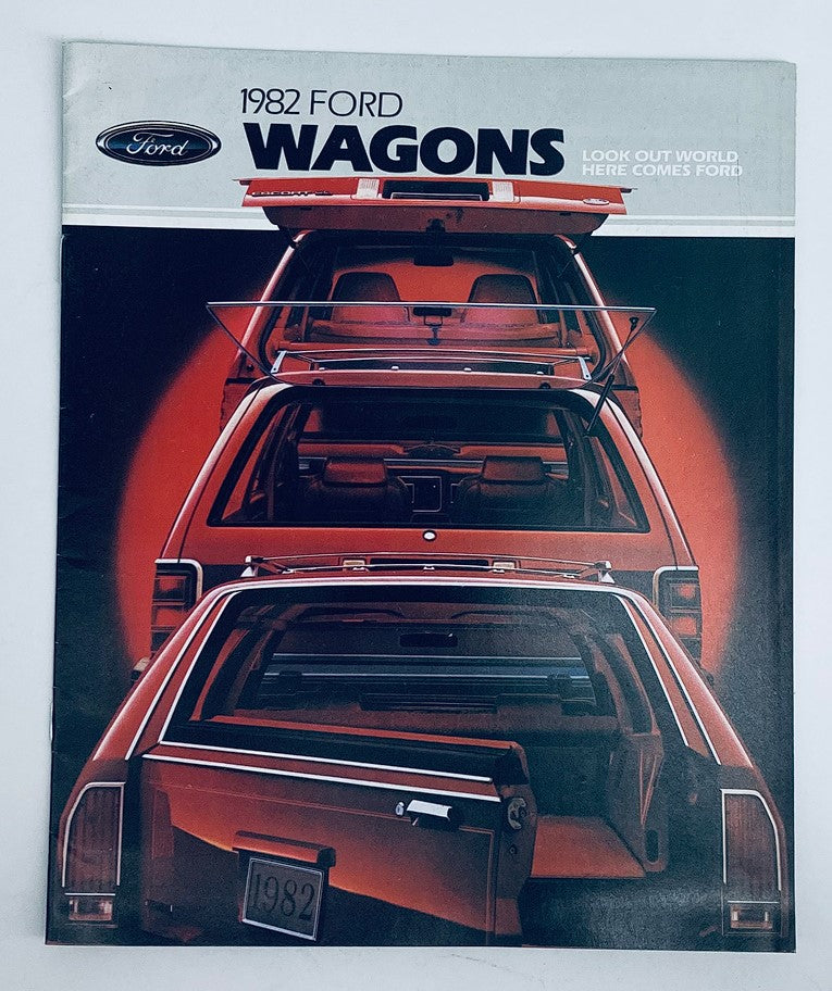 Cover of the 1982 Ford Wagons Dealer Showroom Sales Brochure Guide Catalog featuring an eye-catching design showcasing the rear view of three Ford wagons. The brochure emphasizes the brand with 'LOOK OUT WORLD, HERE COMES FORD' in bold text.