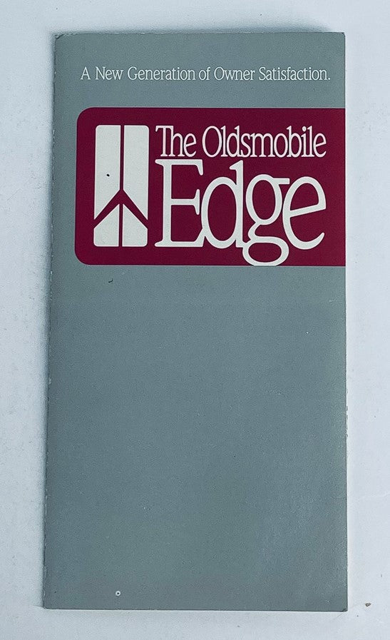 1990 Oldsmobile Edge Dealer Showroom Sales Brochure Cover featuring 'The Oldsmobile Edge' tagline and modern design promoting owner satisfaction.
