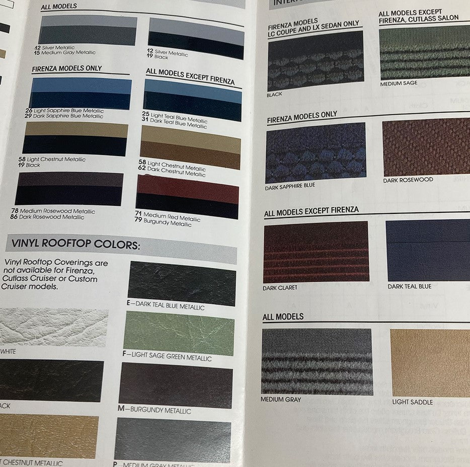 Page from the 1987 Oldsmobile Fabric Folder Dealer Showroom Sales Brochure highlighting color options and vinyl rooftop colors for various models including Firenza and 98 Coupe.